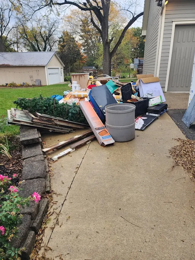 Dumpster being loaded with debris for Residential Dumpster Rental in Mauston